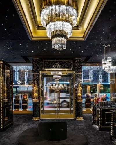 The ornate entrance and chandelier-lit interior of Amaffi Perfume House on Sloane Street in London.